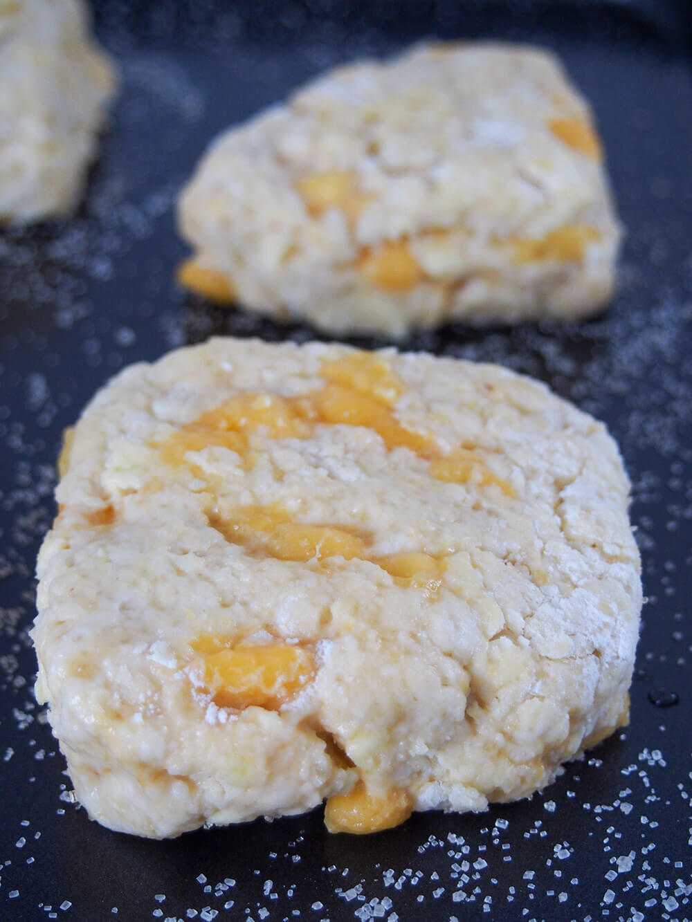 Coconut mango scones on baking sheet before baking
