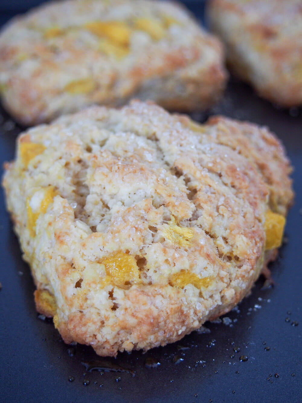 Coconut mango scones on baking sheet just out oven