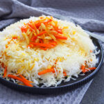 Persian sweet rice (shirin polow) with carrot orange mix on top