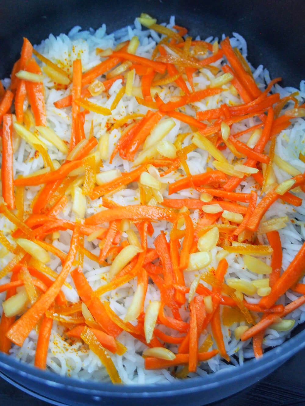carrot orange layer in Persian sweet rice (shirin polow) before steaming