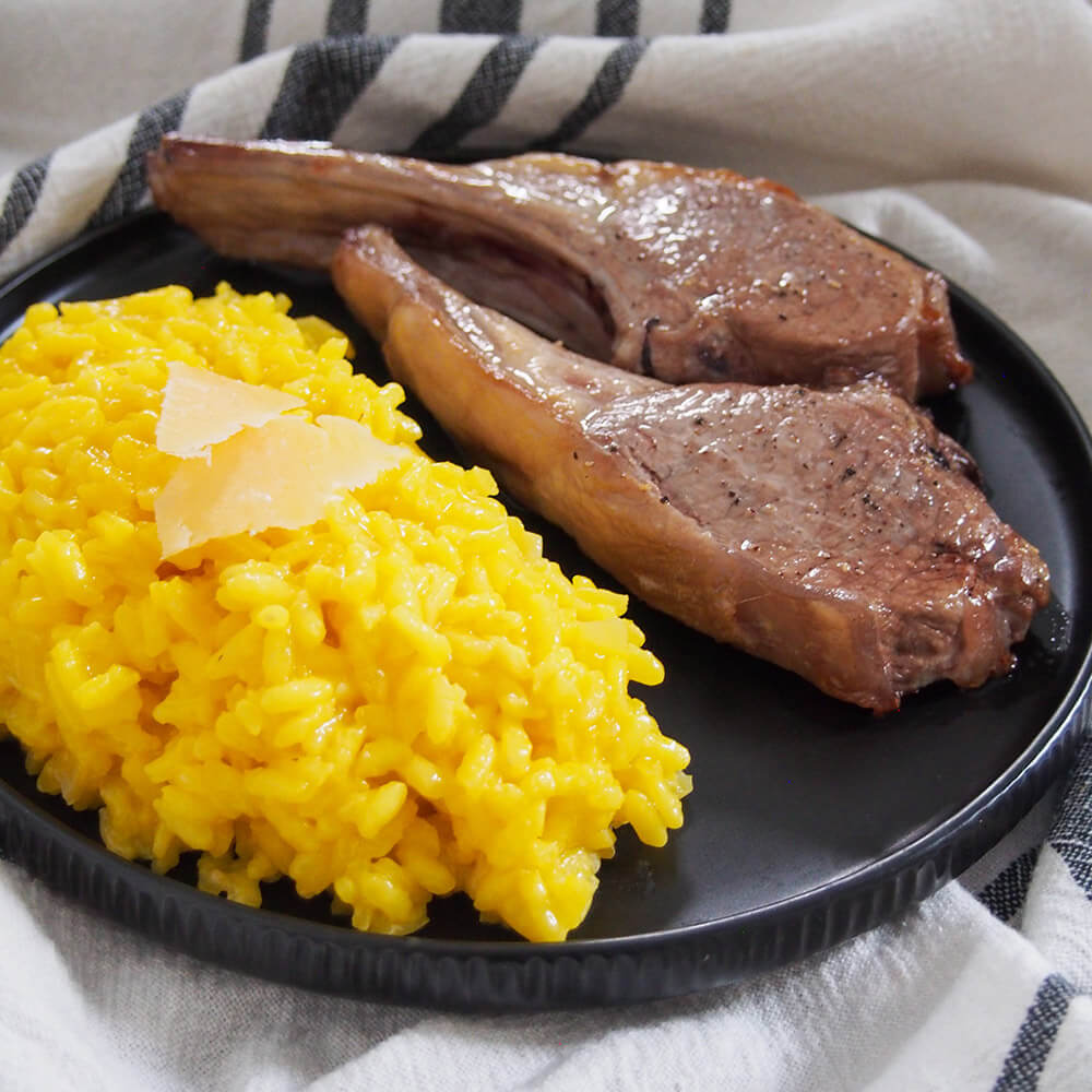risotto served as a side to lamb chops