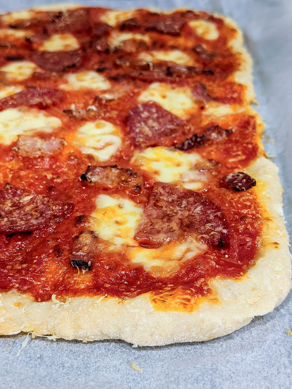 cooked pizza using sourdough pizza dough base