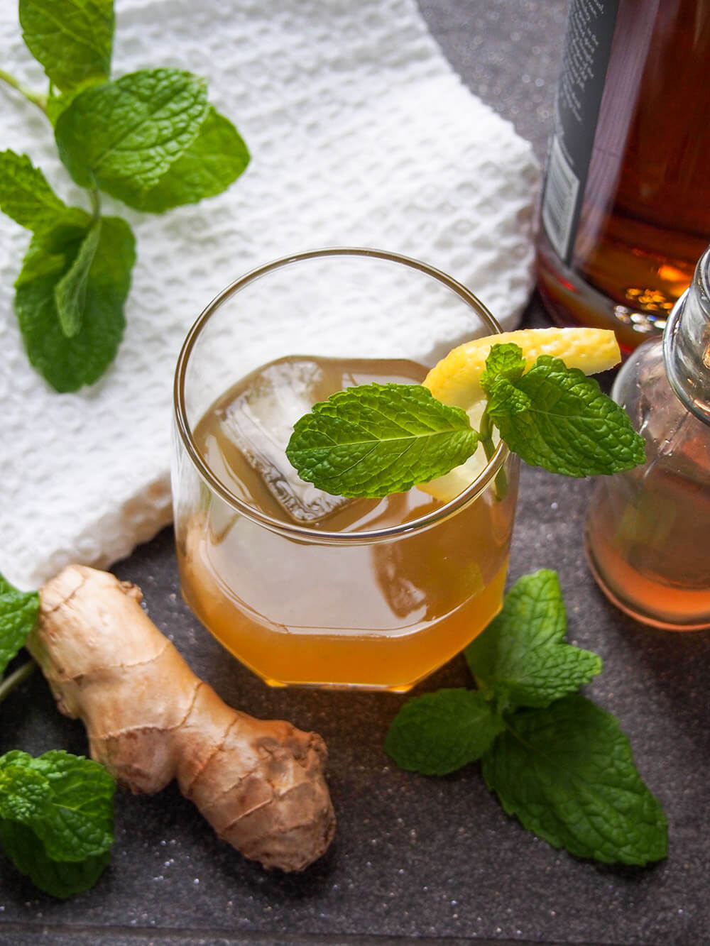 ginger whiskey smash with ginger and mint to side
