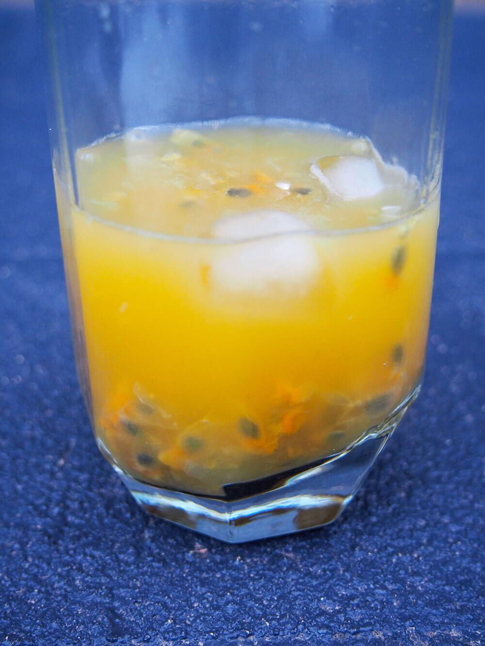 mixing passion fruit margarita