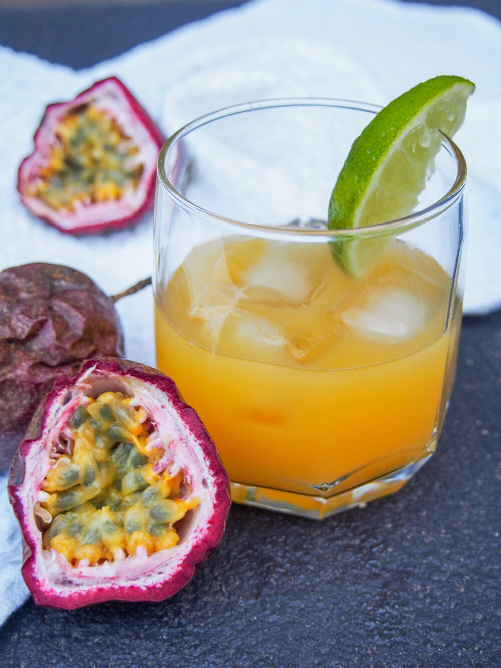 passion fruit margarita with cut passionfruit to side