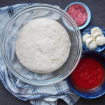 sourdough pizza dough in bowl