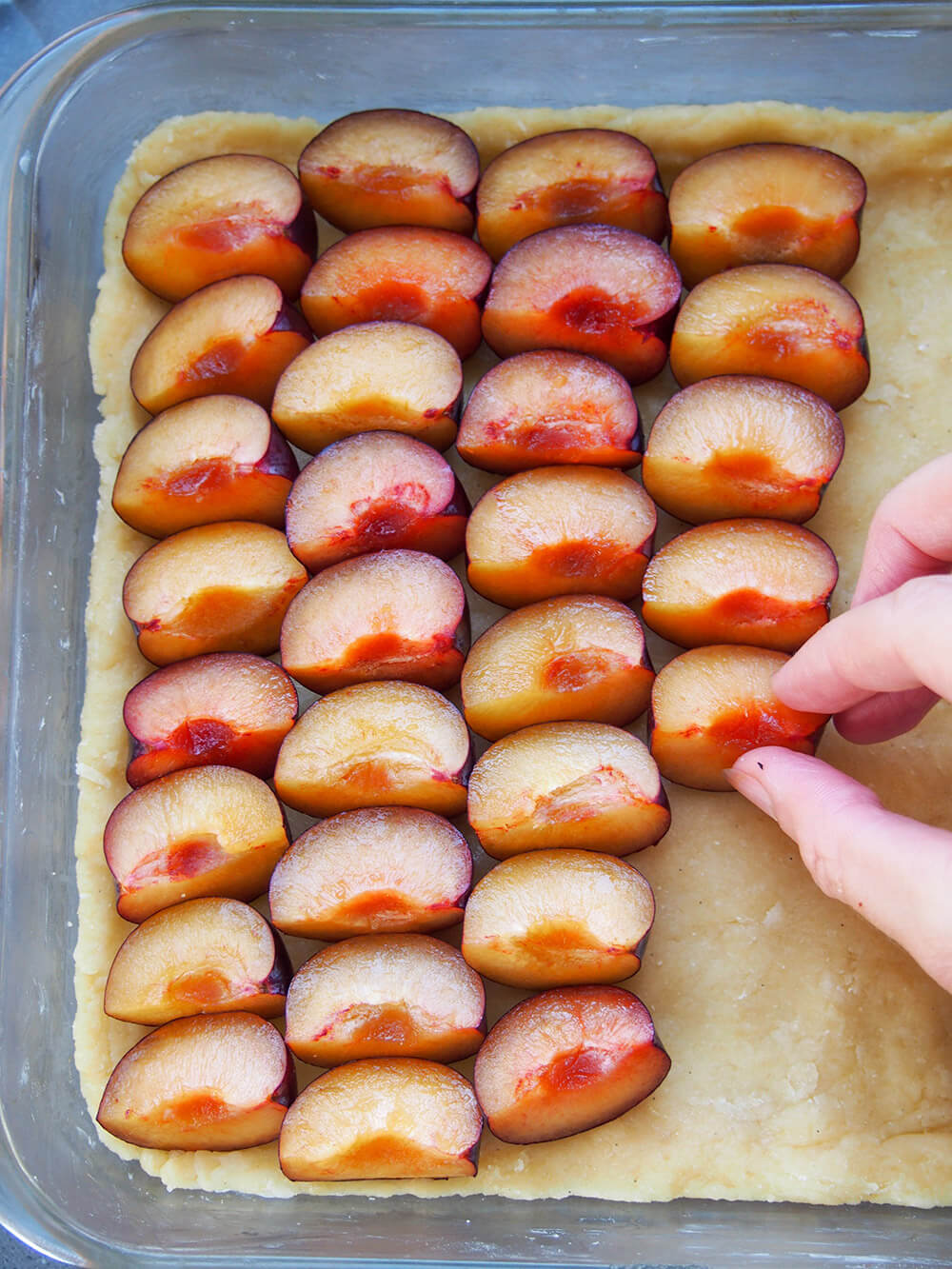 adding layer of plums to base
