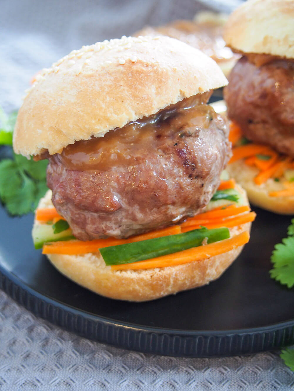 chicken satay burgers stacked and ready to enjoy