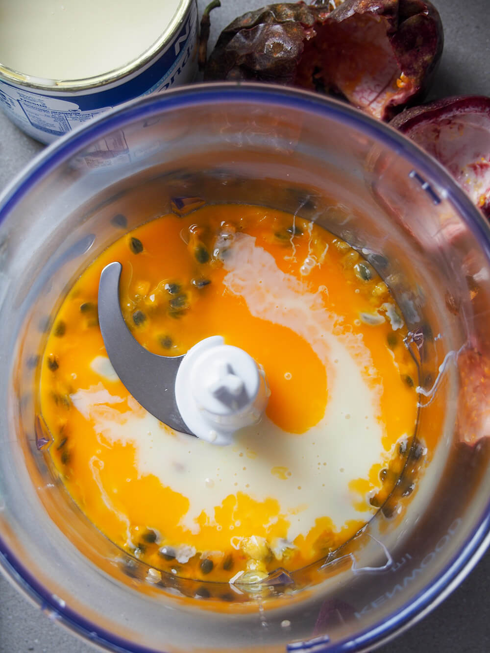 passion fruit pulp and condensed milk in blender