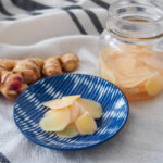 Japanese pickled ginger on plate with jar to side
