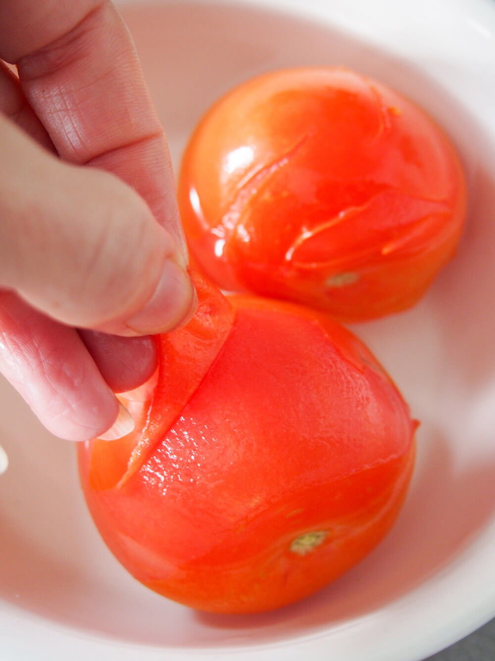 peeling tomatoes for pesto