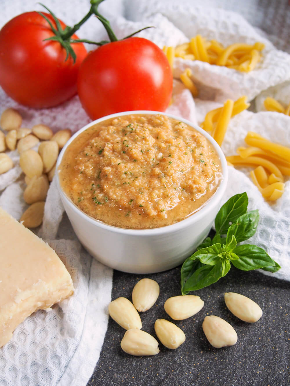 pesto alla Trapanese with sauce ingredients around dish