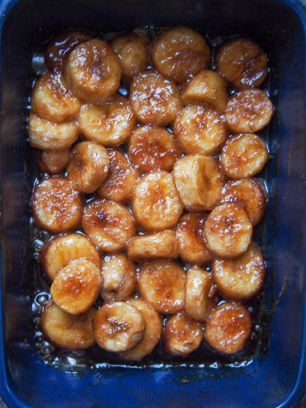 roasted bananas softened and with sugar syrup around them