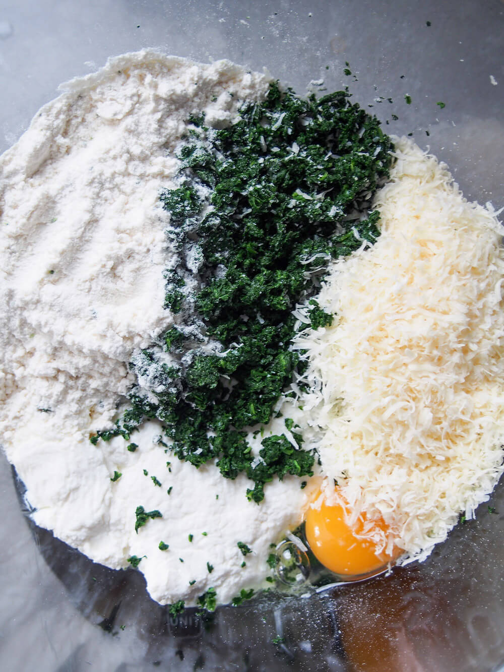 ingredients for ricotta and spinach gnudi ready to mix ingredients in bowl ready to mix