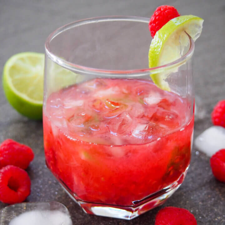 glass of raspberry caipirinha