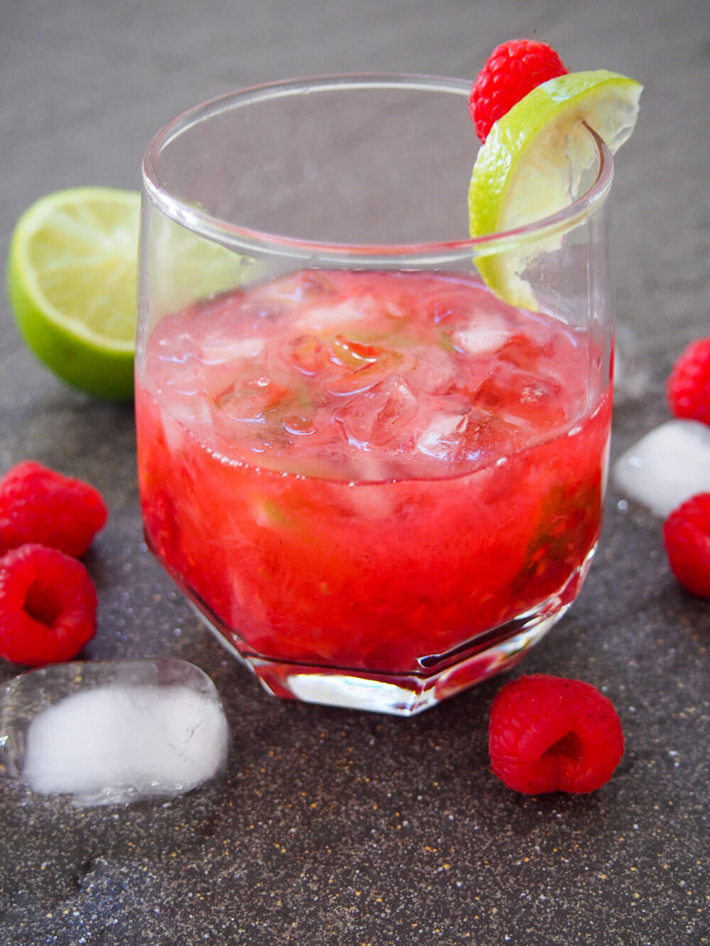glass of raspberry caipirinha