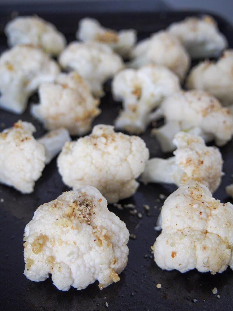 cauliflower coated with dukkah ready to roast