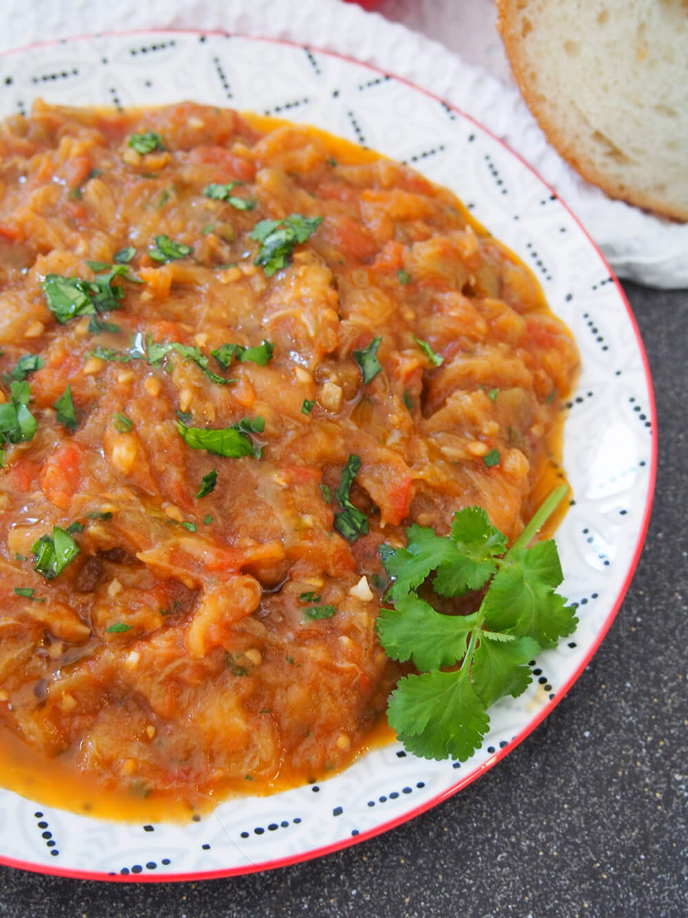 plate of zaalouk decorated with cilantro