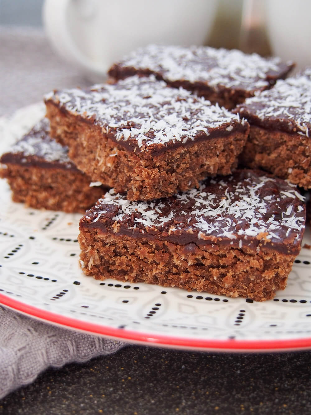 side view of pieces of chocolate slice on plate