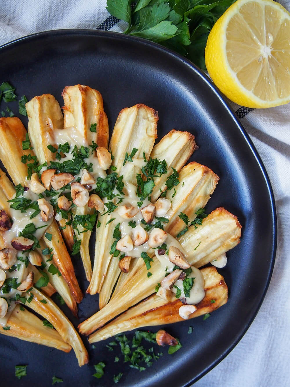partial view of plate of maple roasted parsnips