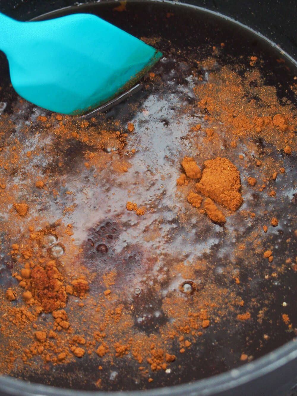 mixing spices into simple syrup