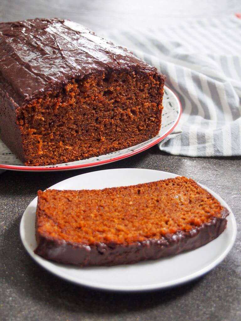 slice of piernik Polish gingerbread cake in front of rest of loaf