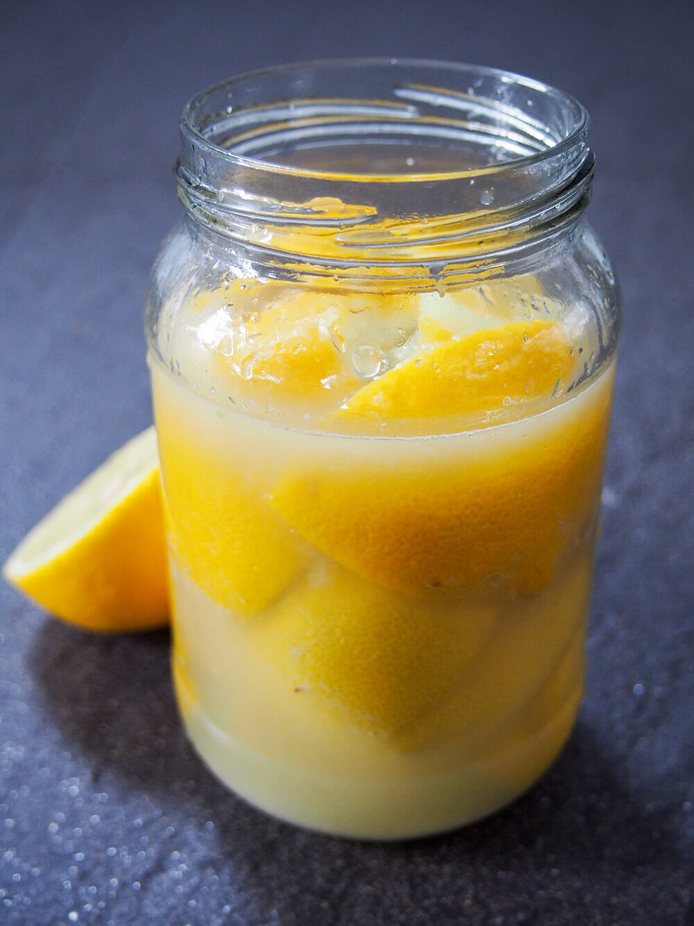 preserved lemons in jar ready to leave to mature