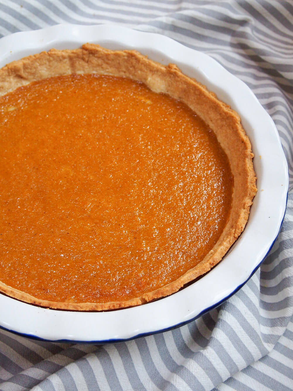 part view of whole pumpkin pie