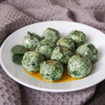 Ricotta and spinach gnudi on plate with sage browned butter