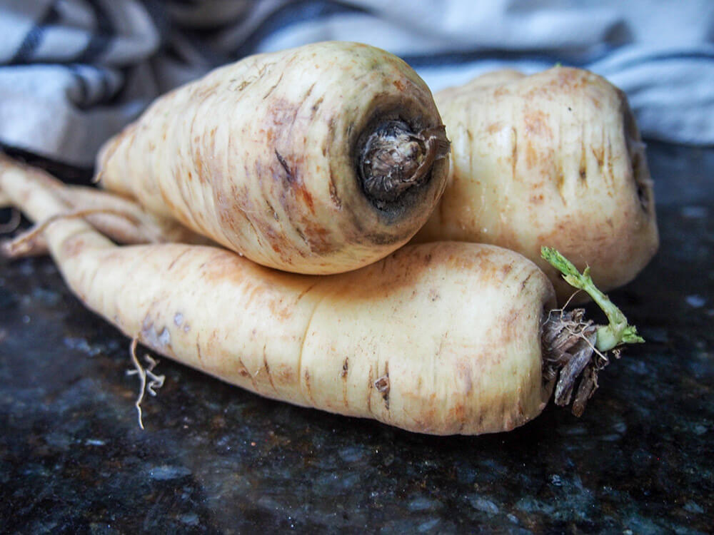 whole parsnips sitting on counter