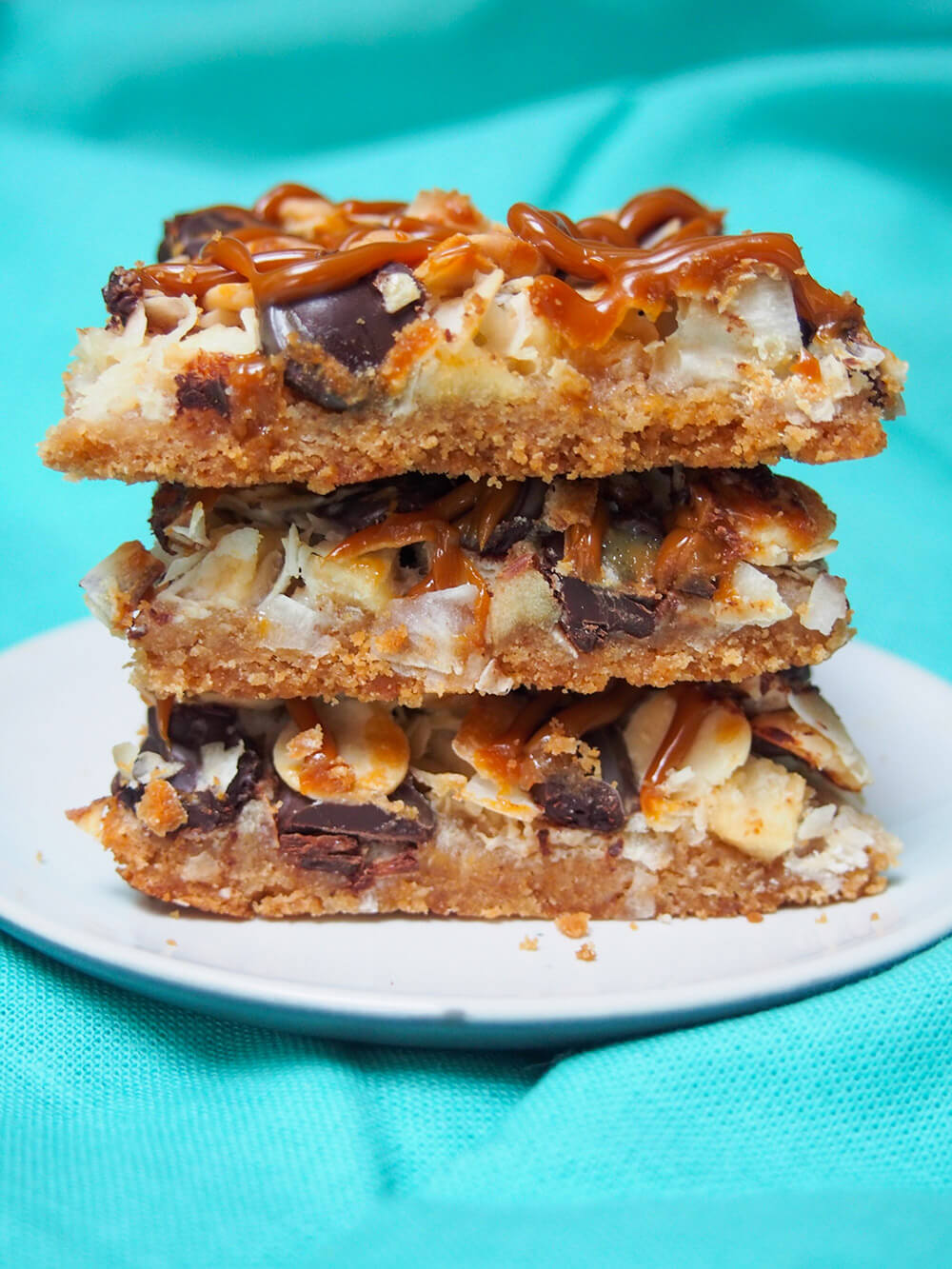 stack of three caramel apple magic bars on plate