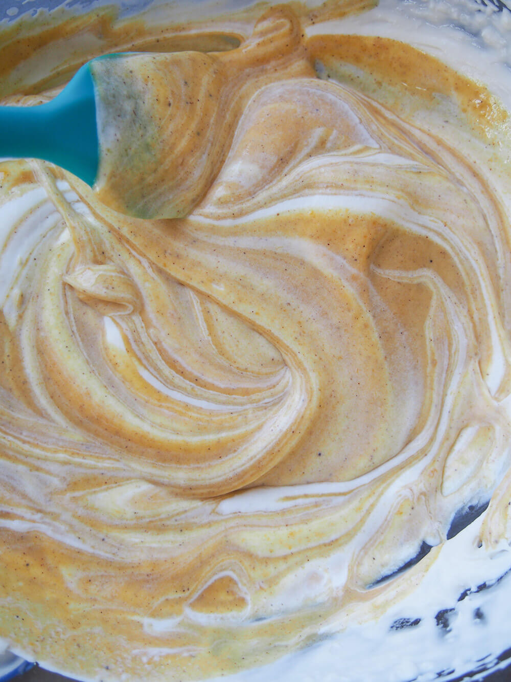 folding pumpkin mixture and cream together