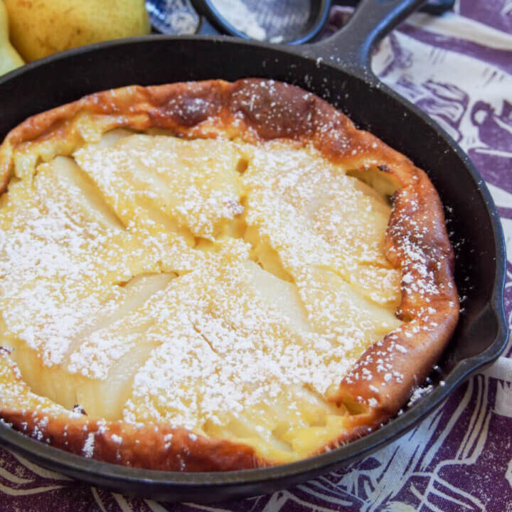 pear clafoutis in skillet part view from side