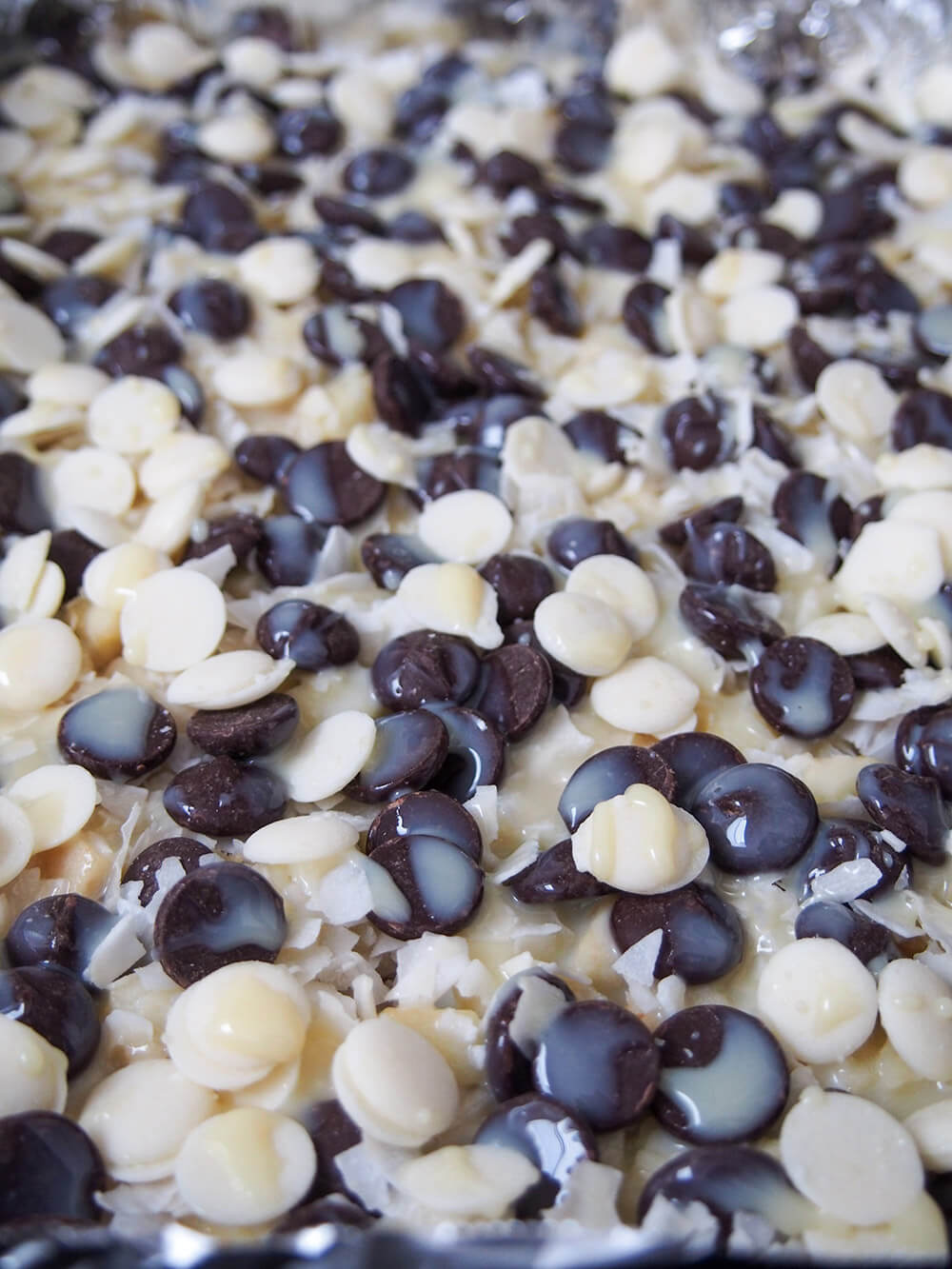 condensed milk over chocolate chip layer before baking