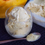 glass of no churn pumpkin ice cream with spoon in front