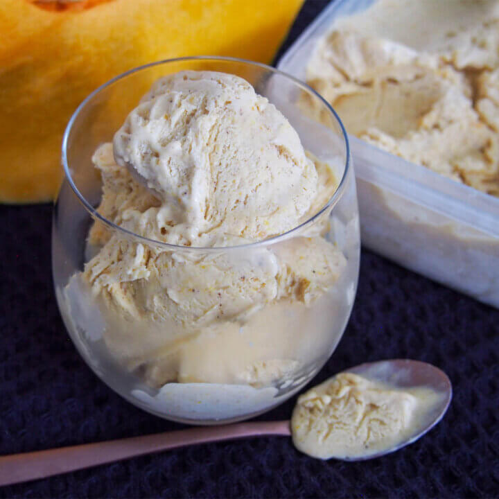glass of no churn pumpkin ice cream with spoon in front