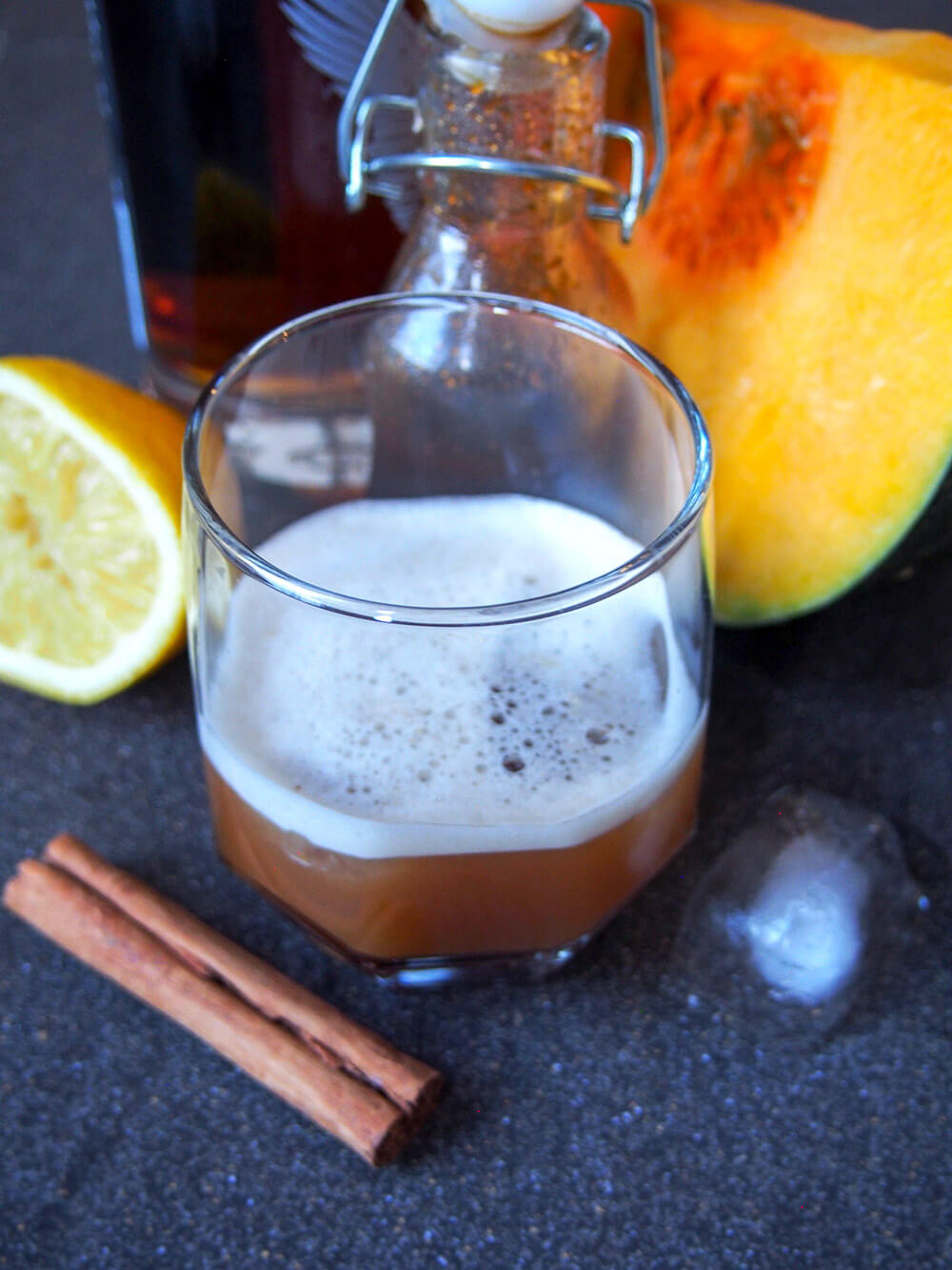 This pumpkin spice whiskey sour is the pumpkin spice cocktail you've been searching for! It's easy to make, with a wonderful balance of warm spices and tart lemon. A wonderful warm twist on a classic. glass of pumpkin spice whiskey sour from above