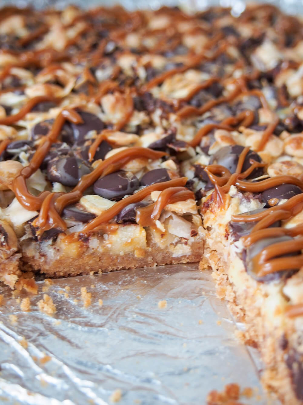 block of caramel apple magic bars with gap where some are cut out