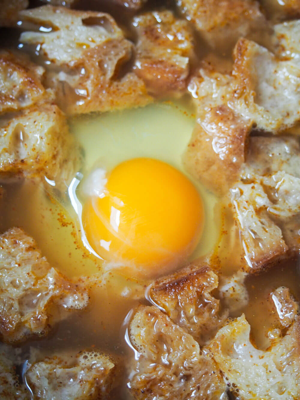 adding egg in to soup