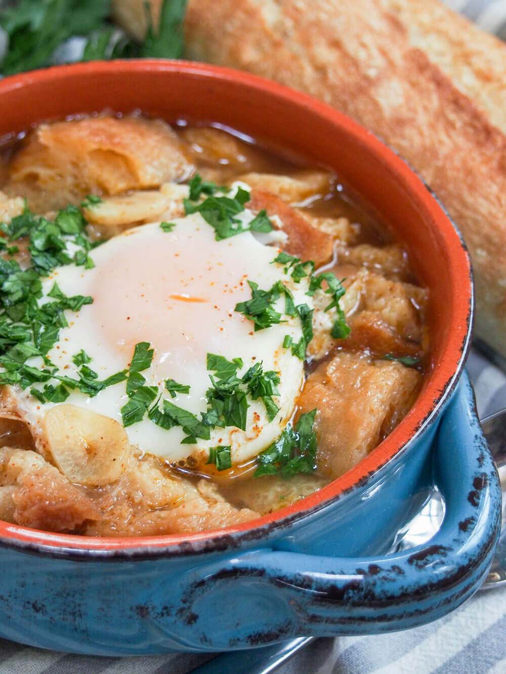 close up of sopa de ajo in bowl