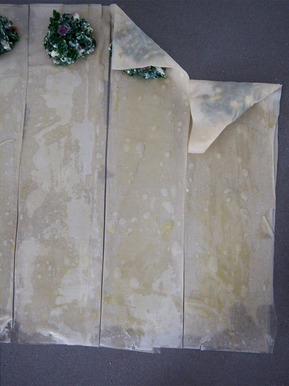 steps folding spanakopita triangles
