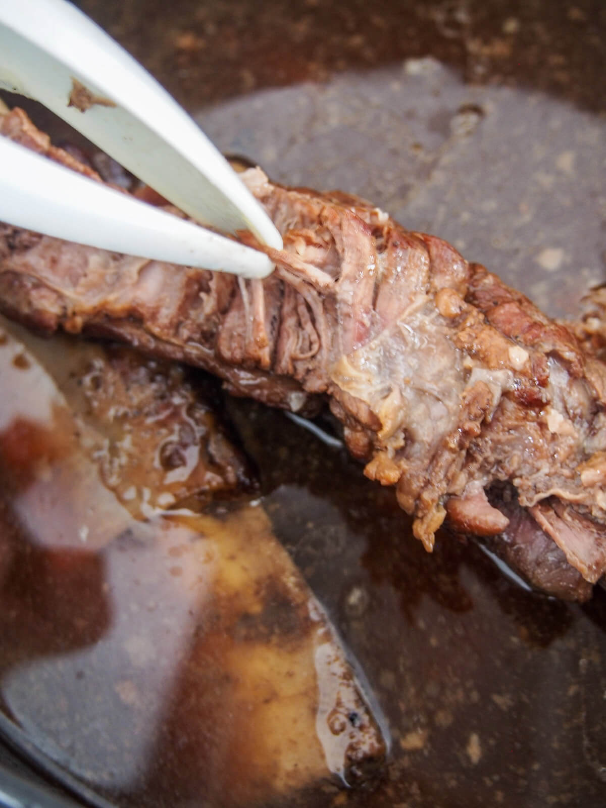 shredding short rib meat from bones