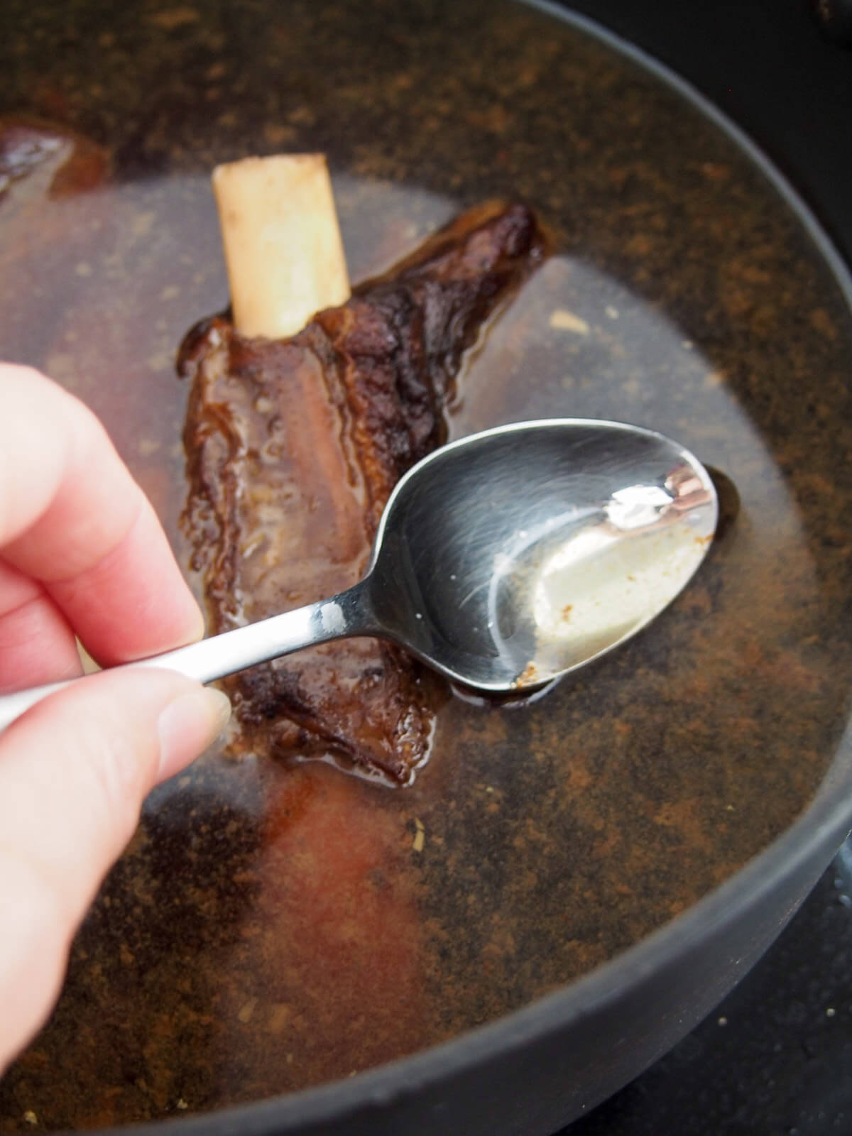 skimming fat from short rib broth