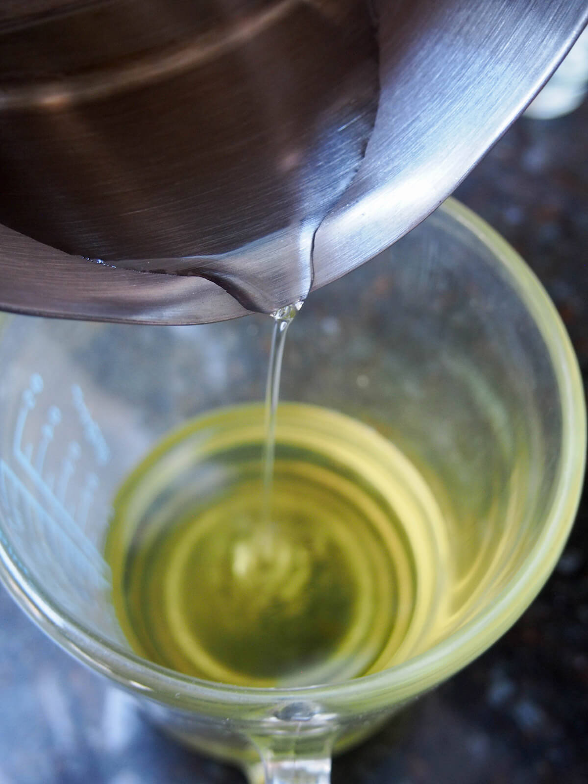 adding simple syrup to limoncello