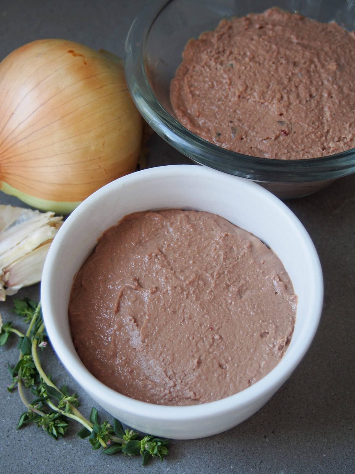 pureed pate in two small dishes before topping with butter