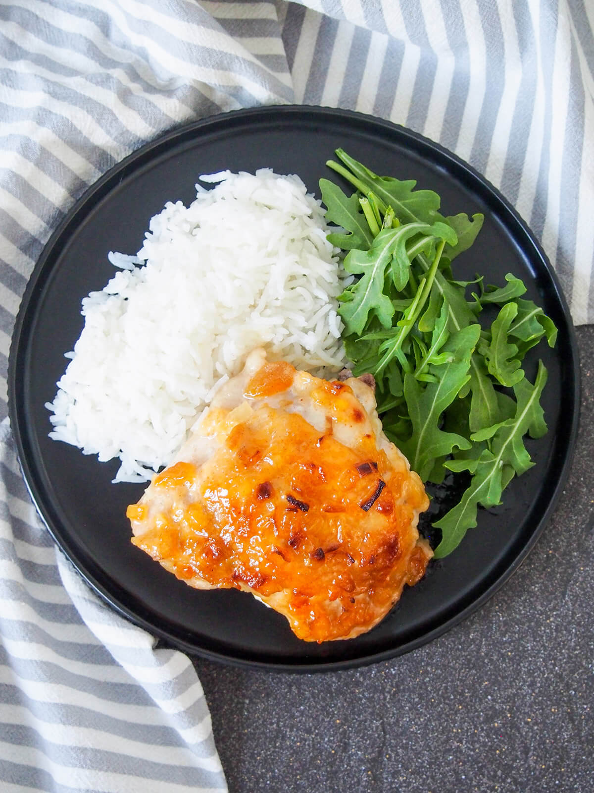 plate of chutney chicken, rice and salad