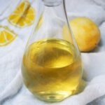 close up of homemade limoncello in bottle