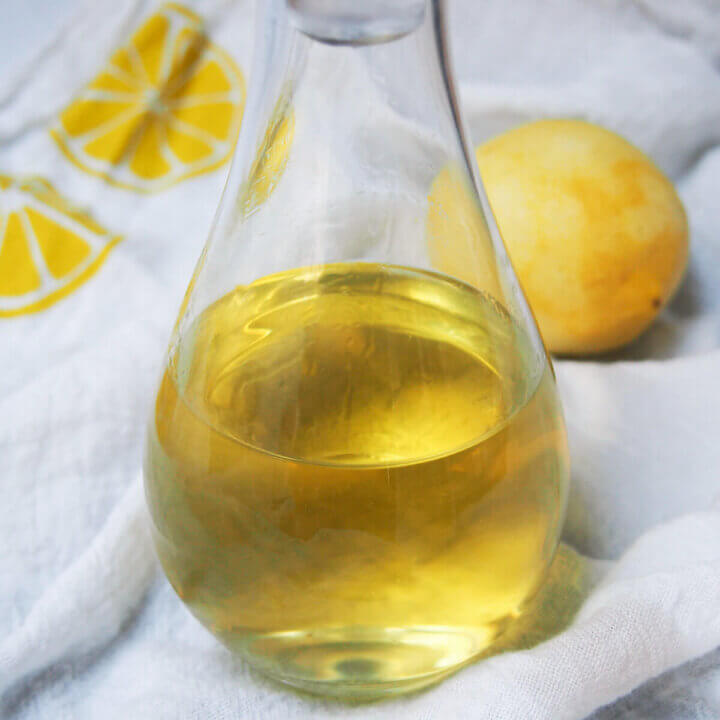 close up of homemade limoncello in bottle