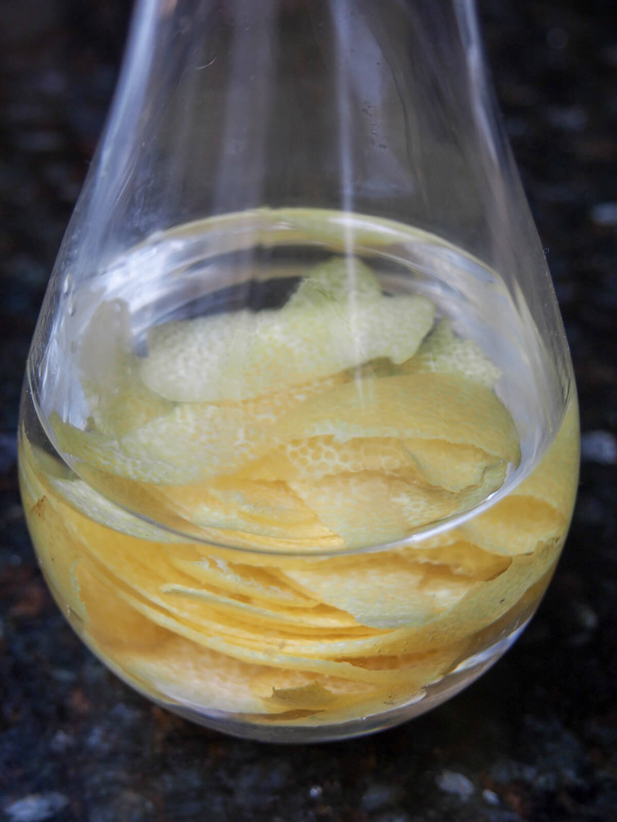 pieces of zest infusing in alcohol