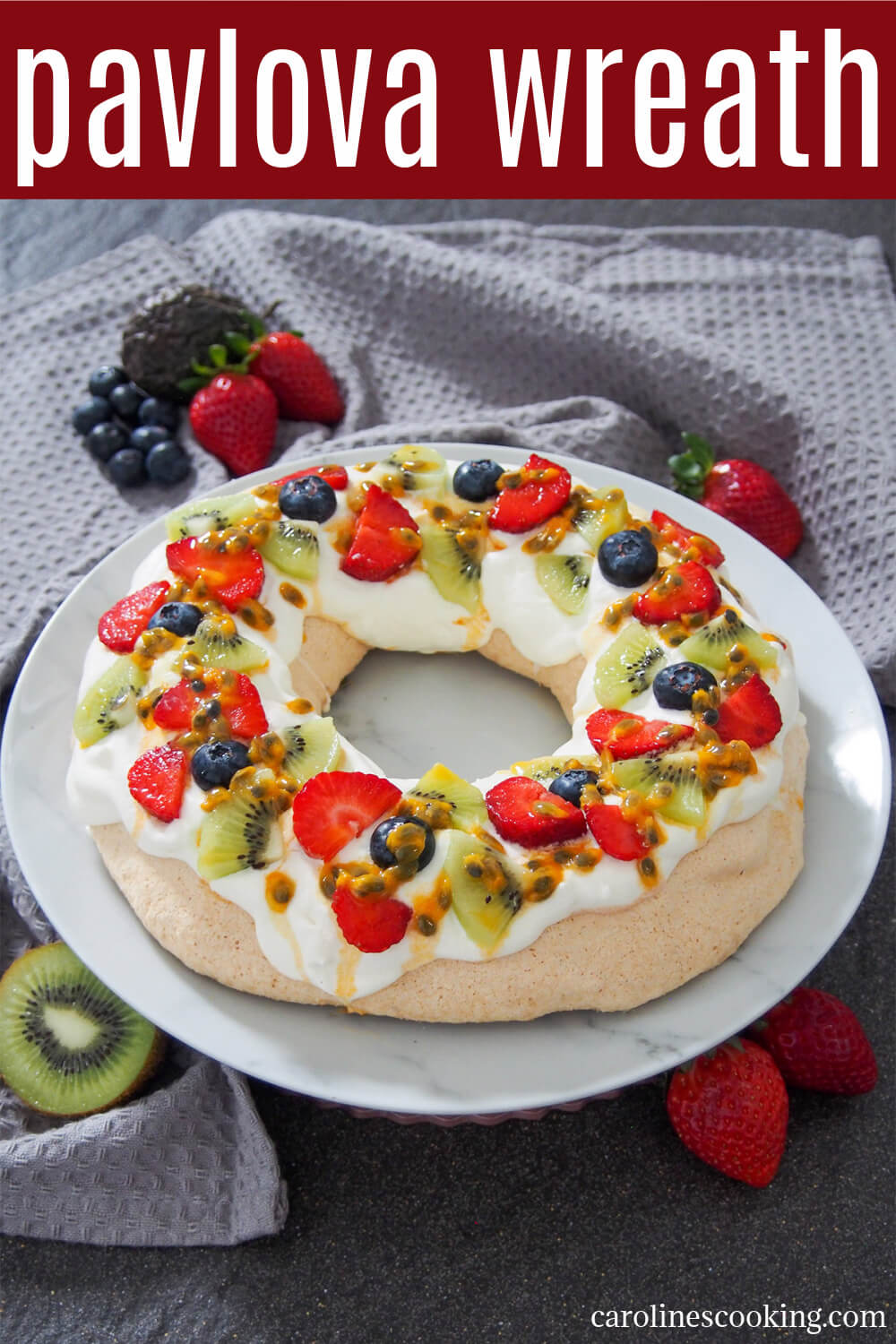 This pavlova wreath is a festive twist on a classic dessert. The combination of meringue with a chewy middle, cream and fruit is delicious & elegant. #pavlova #christmas #dessert